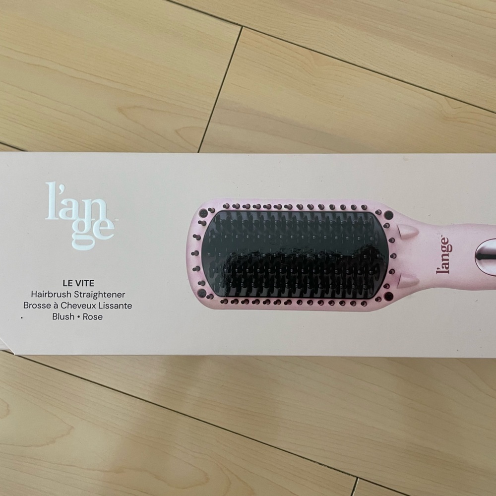 Lange hairbrush straightener. Brand new.
